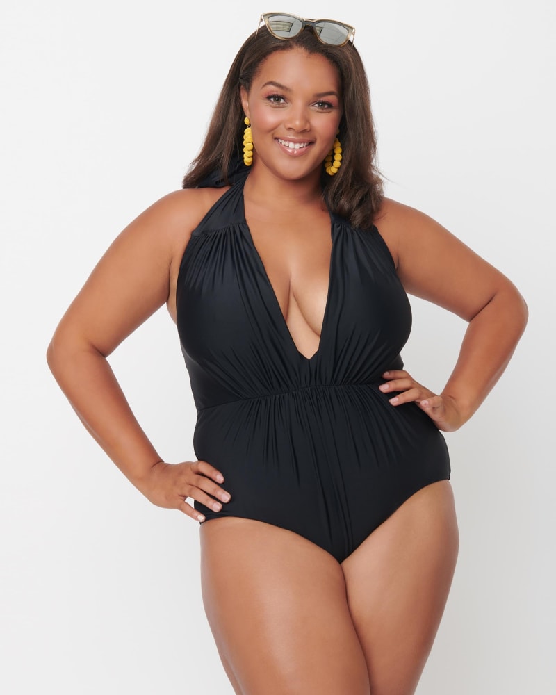 Front of a model wearing a size 2X Unique Vintage Black Halter Shirred Derek One Piece Swimsuit in Black by Unique Vintage. | dia_product_style_image_id:288799